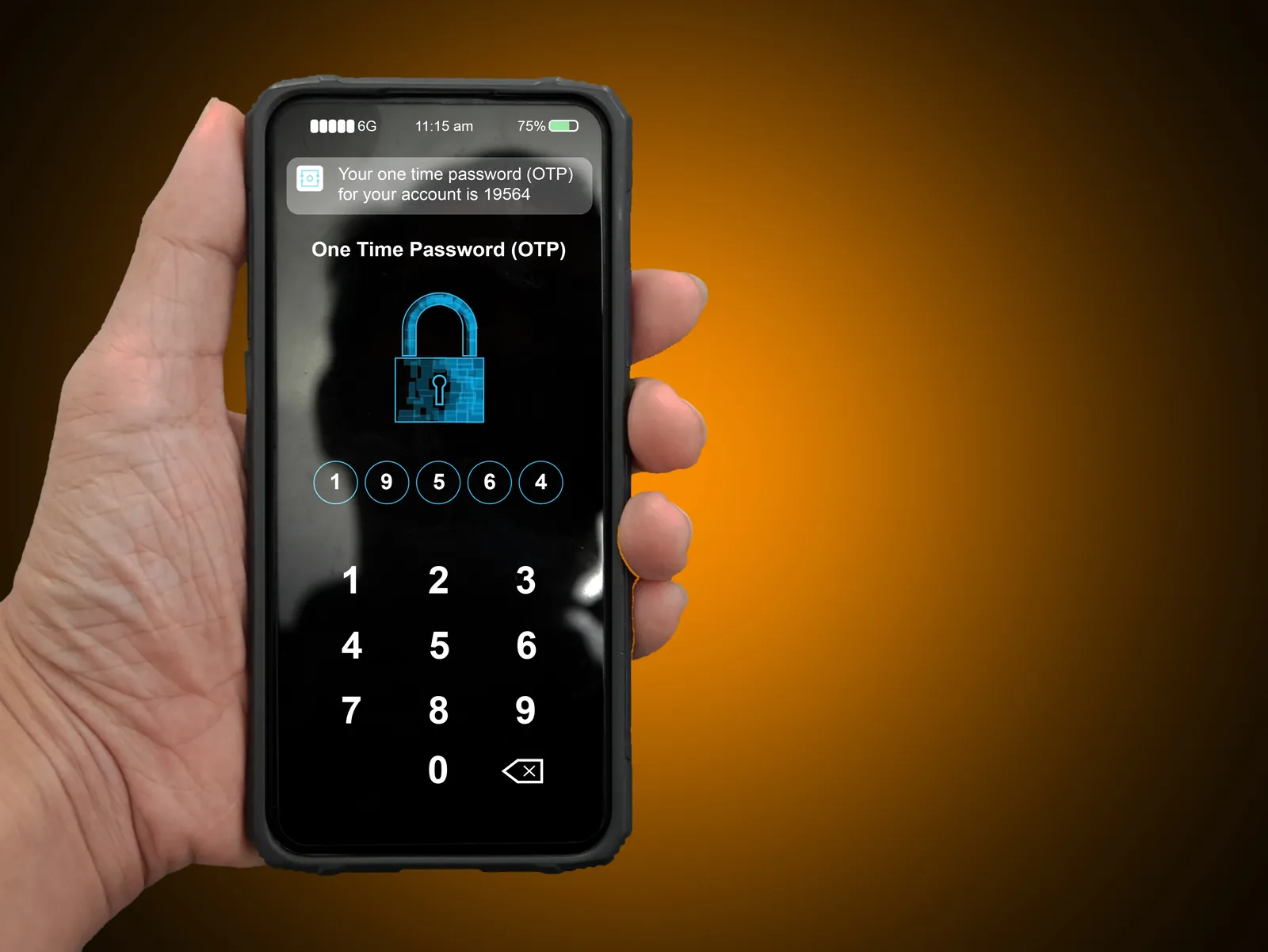 Hand holding a phone showing a one-time PIN code